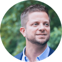 A smiling man in blue shirt