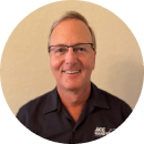 a smiling man in black shirt