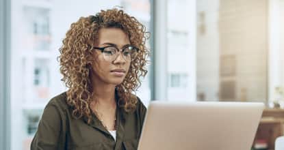a young man cleaning glass with cloth and cleaner