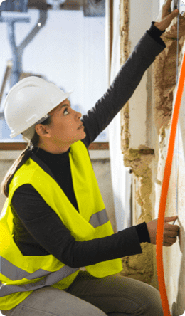 woman measuring wall length