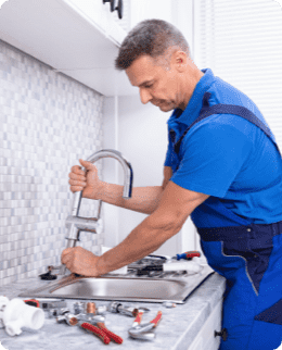 working man fixing the sink